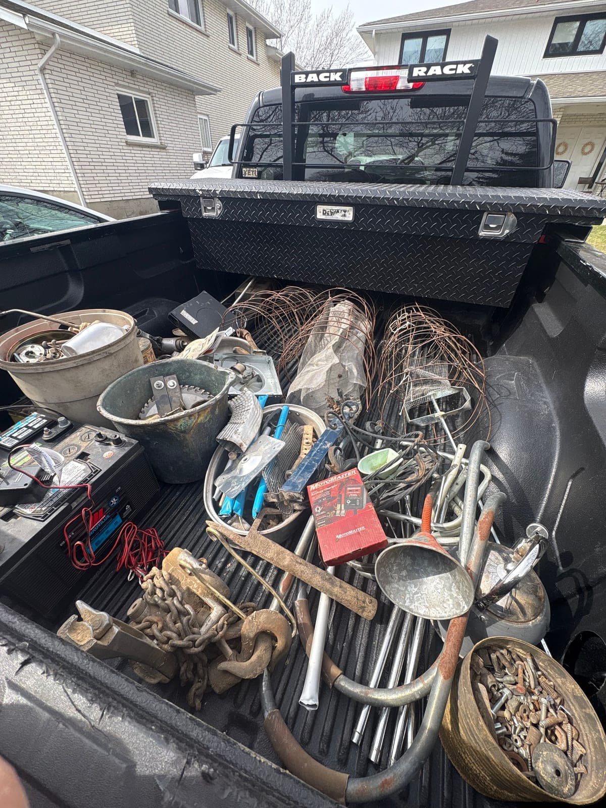 Truck bed loaded with copper, steel, and appliances after a Niagara Scrap Solutions pickup